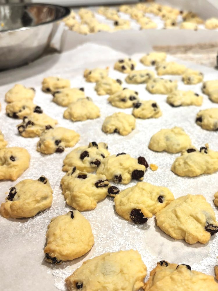 Currant studded cookies dusted with powdered sugar